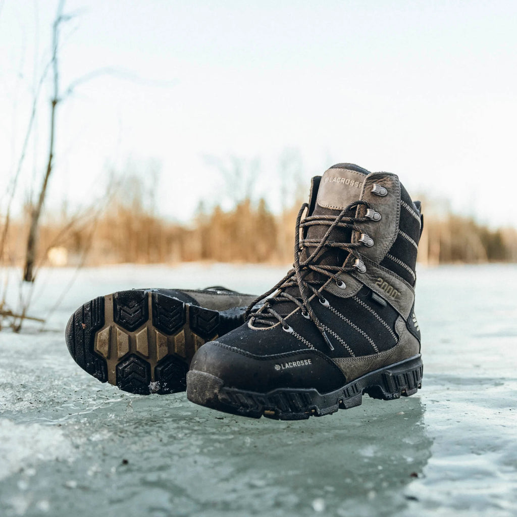Pair of LaCrosse Cold Snap II boots on ice showing front and outsole views