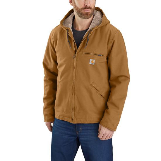 Model wearing the Carhartt men's Washed Duck Sierra Jacket 104392 in brown, showing the front and sherpa-lined hood